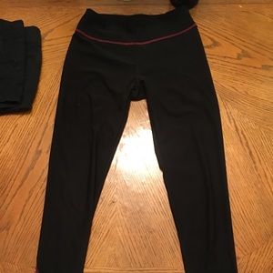 Black yoga pants with pink detail